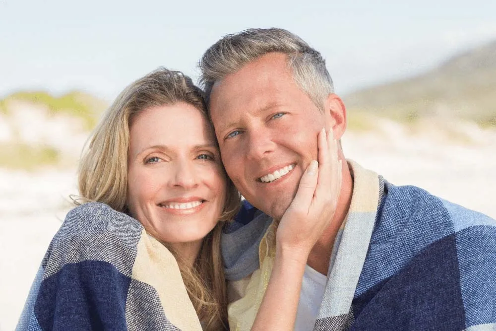 Top Cosmetic Dentist in Woodstock Woman relaxing at home with windblown hair
